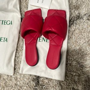 Bottega Veneta leather slides, raspberry pink.